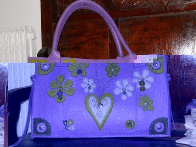 borsa_viola.JPG (188.57 KiB) Osservato 608 volte borsa_viola.JPG