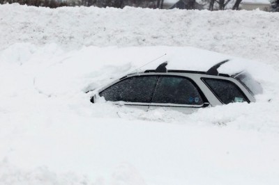 A-vehicle-is-shown-submerged-in-snow-sits-on-interstate-I-190-in-West-Seneca-New-York.jpg
